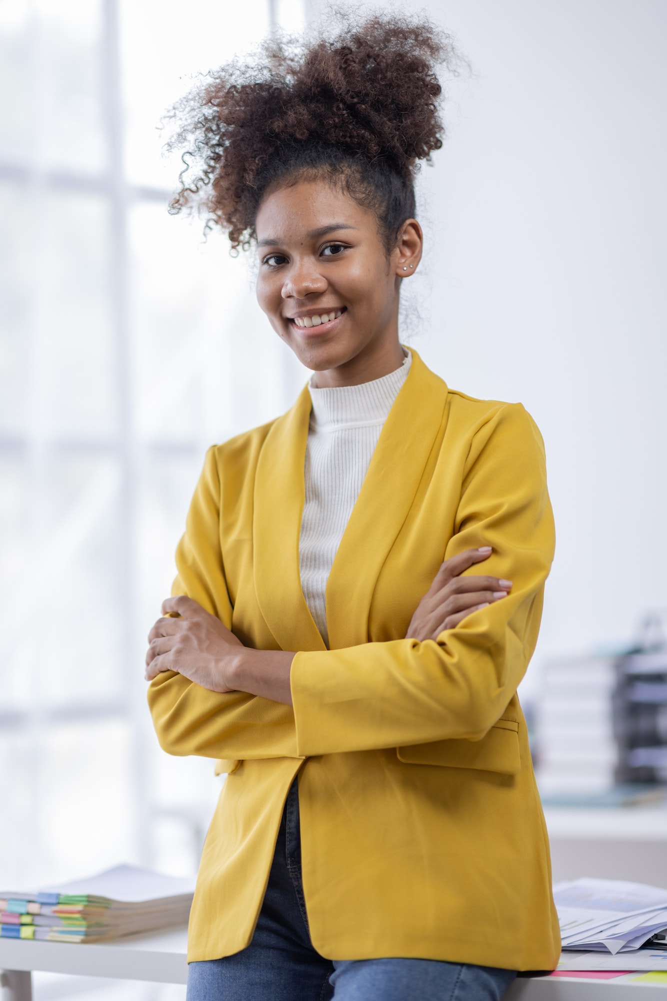 Caucasian Young business african american woman smiling in office